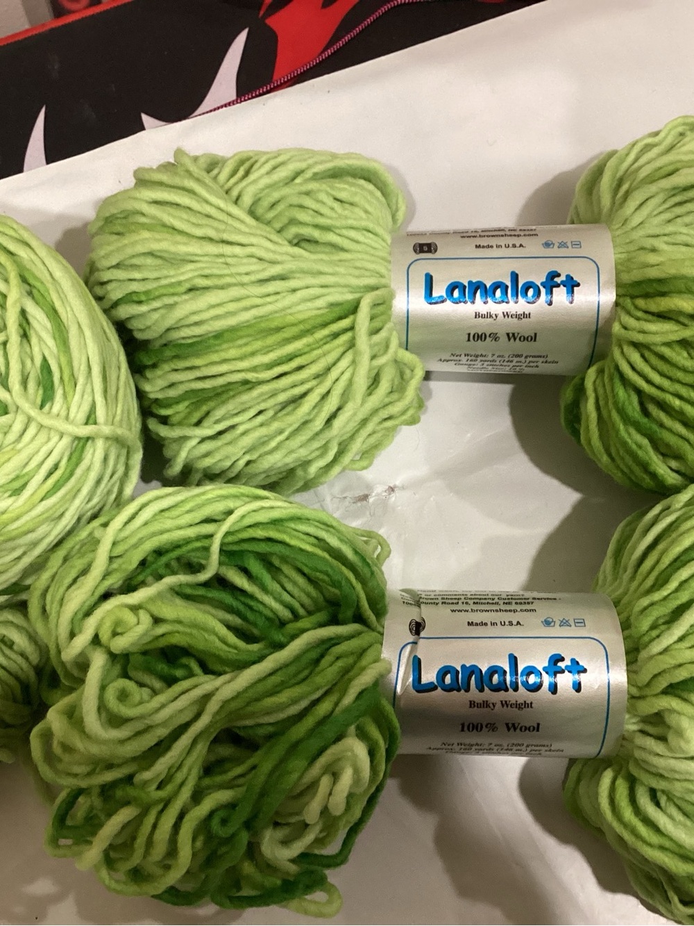 3 hanks + partial of brown sheep co Lanaloft bulky weight yarn in spring sprouts